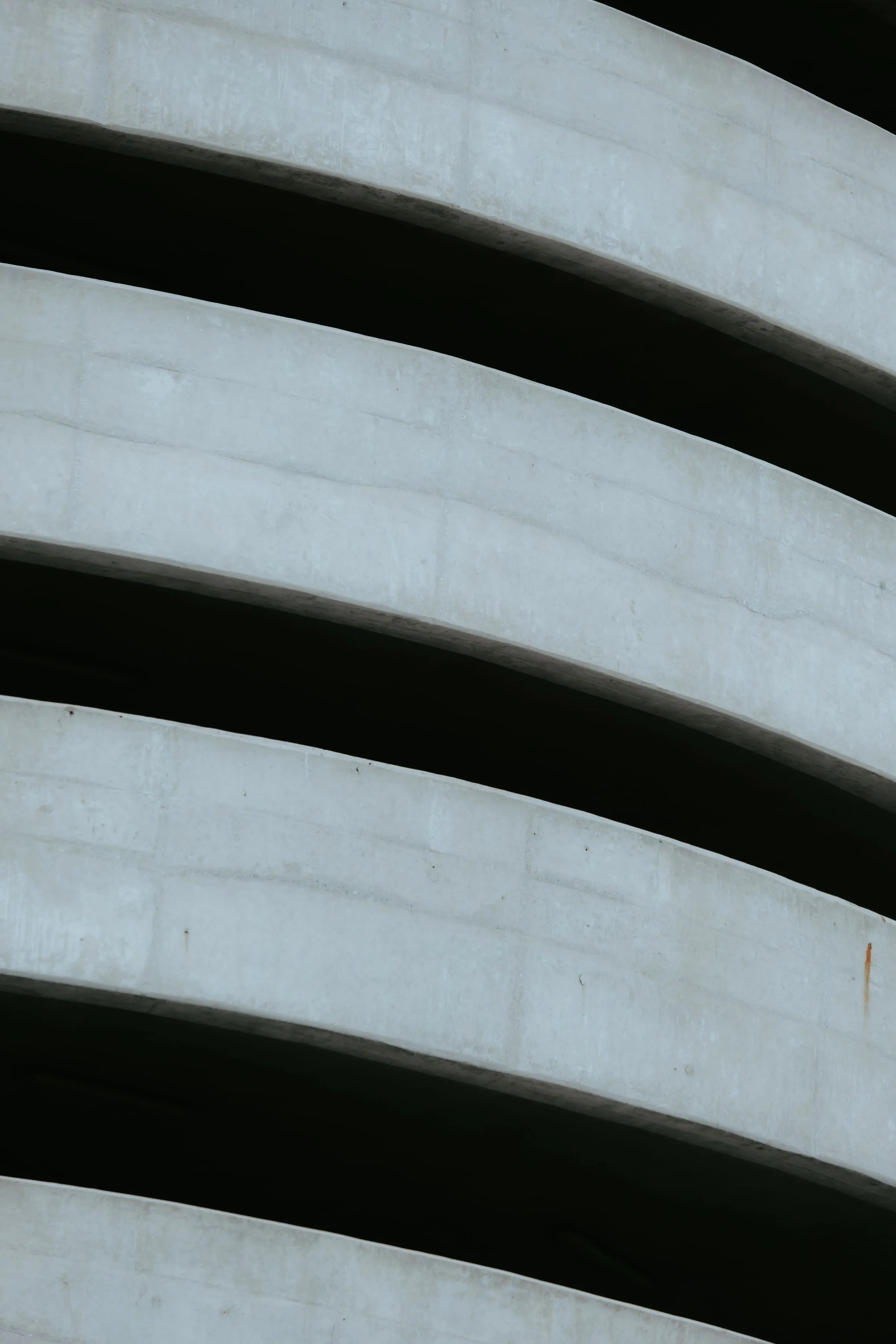 A curved concrete ramp seen from below.